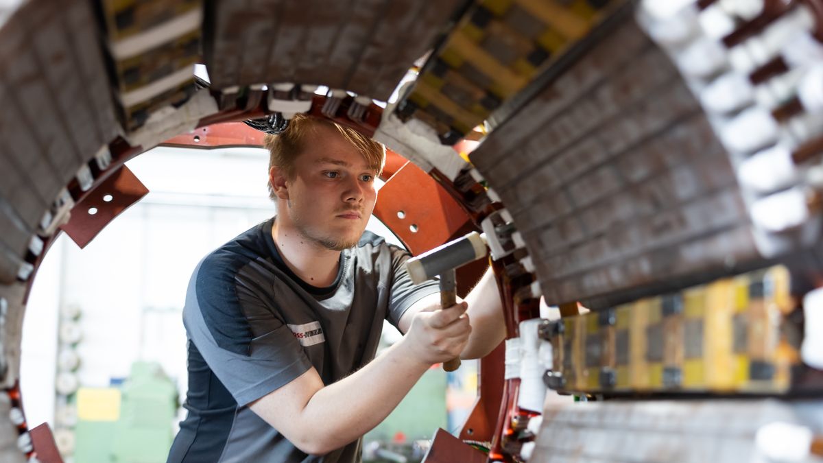 DORTMUND, GERMANY - AUGUST 20: Trainee Tim works on a 750-kilowatt three-phase motor at BOSS - Steinlen Electrical Machinery and Pumps GmbH, an electrical machinery repair company on August 20, 2026 in Dortmund, Germany. The German economy is facing complex challenges in its labor market. On the one hand artificial intelligence has begun displacing workers in certain sectors and many German manufacturers are shedding jobs. On the other hand chronic labor shortages persist in many other sectors. According to a recent report one third of trainees in Germany are dissatisfied with their training program. (Photo by Andreas Rentz/Getty Images)
