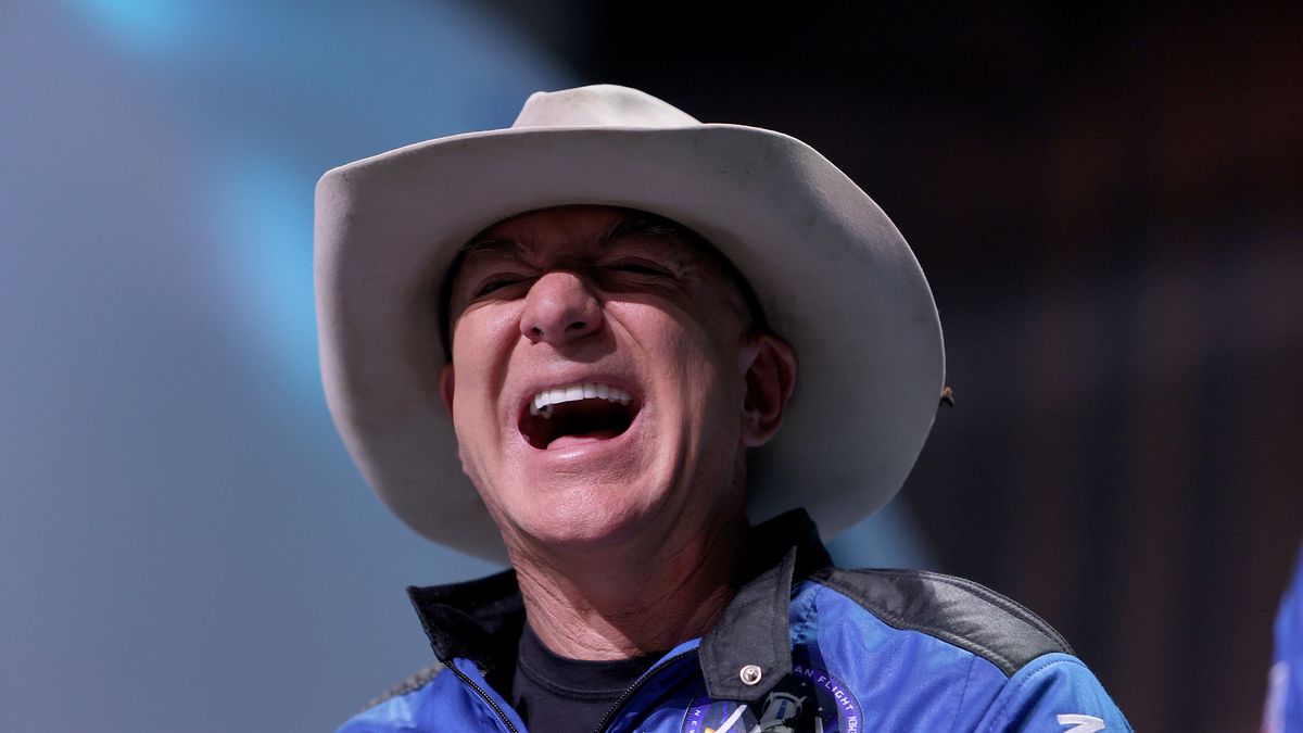 VAN HORN, TEXAS - JULY 20: Jeff Bezos laughs as he speaks about his flight on Blue Origin’s New Shepard into space during a press conference on July 20, 2021 in Van Horn, Texas. Mr. Bezos and the crew that flew with him were the first human spaceflight for the company.   (Photo by Joe Raedle/Getty Images)