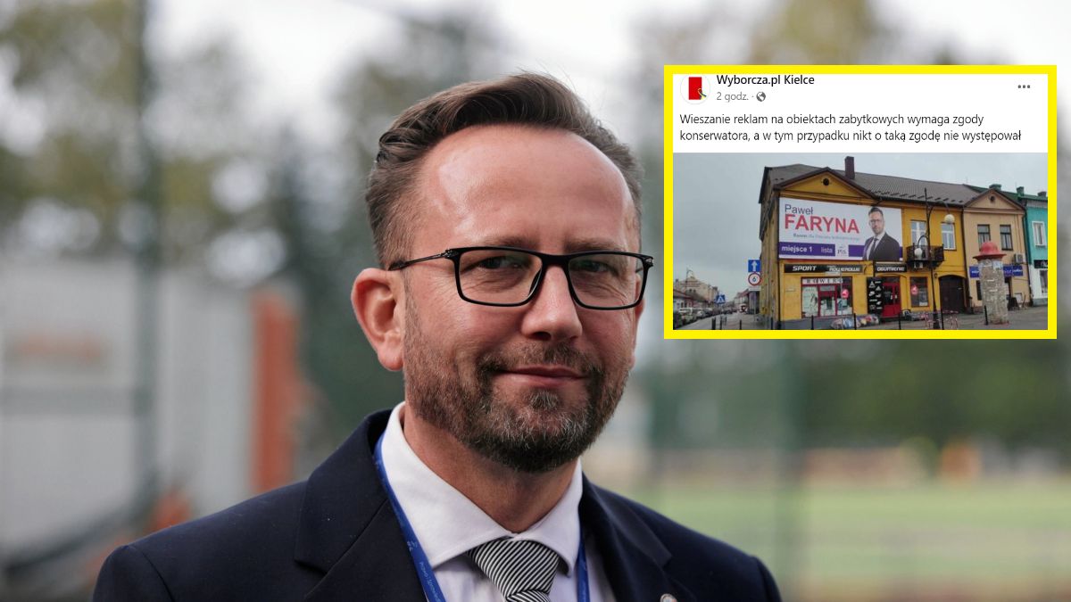 Baner na zabytkowej kamienicy w centrum Jędrzejowa