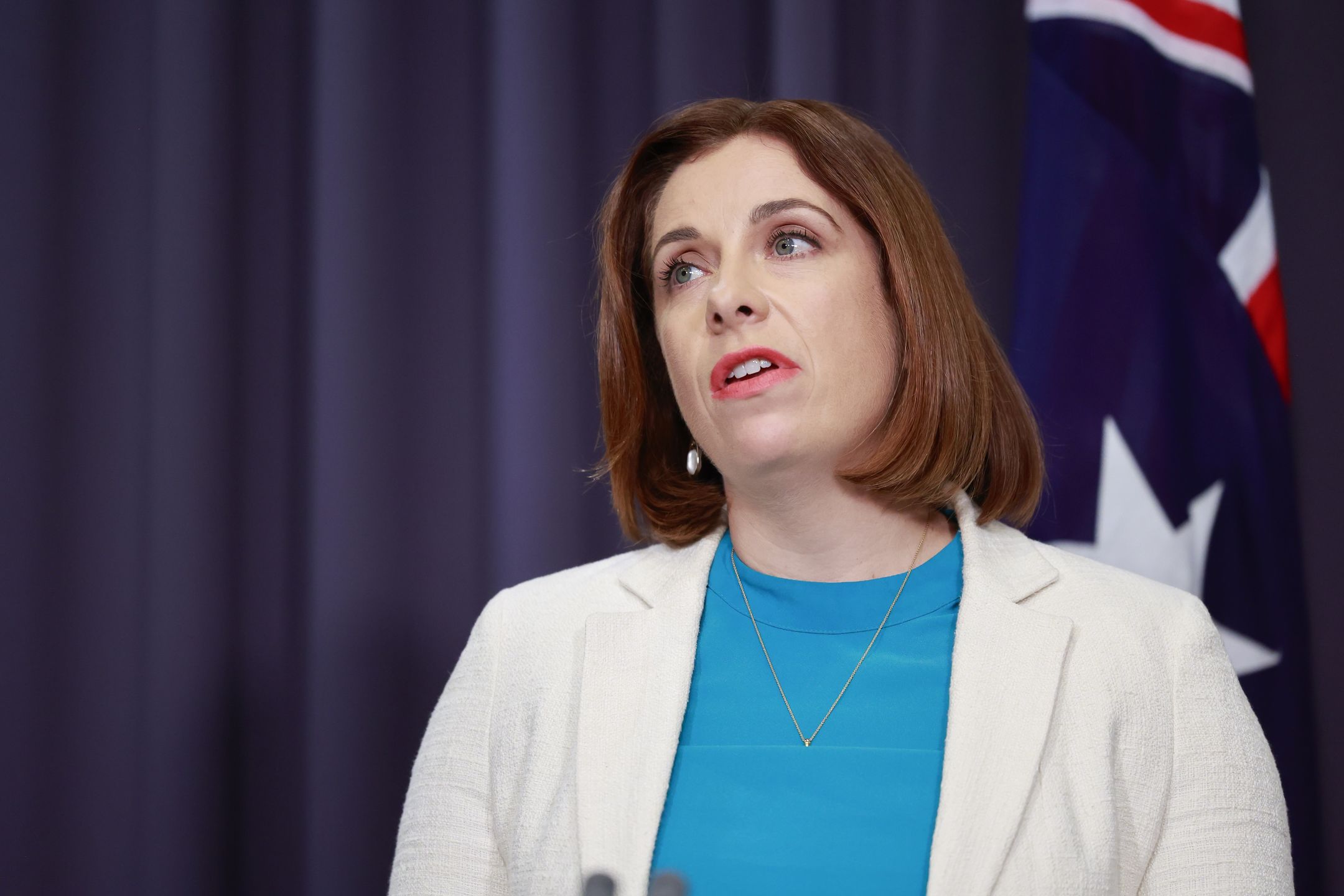 CANBERRA, AUSTRALIA - NOVEMBER 05: The Hon Minister for Sport and Communications Anika Wells speaks to the media at Parliament House on November 05, 2025 in Canberra, Australia. Australia's Parliament convened for sittings as a number of pressing issues come to the fore, from inflation and cost of living domestically to Australia's relationship with its allies in the region and beyond internationally. (Photo by Hilary Wardhaugh/Getty Images)