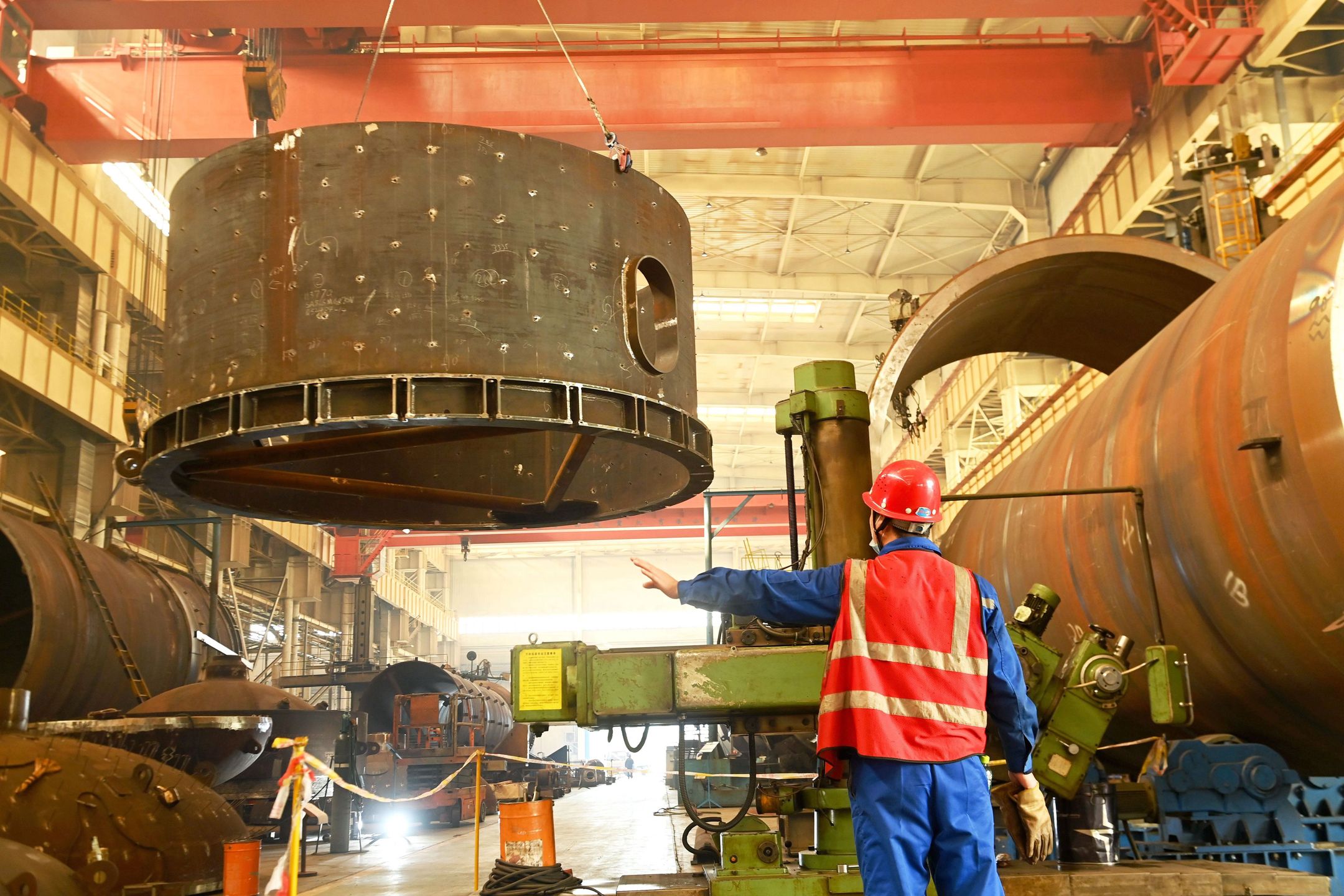 QINGDAO, CHINA - OCTOBER 31, 2024 - A construction worker builds petrochemical equipment parts at Lanshi Heavy Machinery Co., LTD., Hongshiya Street, Qingdao, Shandong province, Oct 31, 2024. (Photo credit should read CFOTO/Future Publishing via Getty Images)