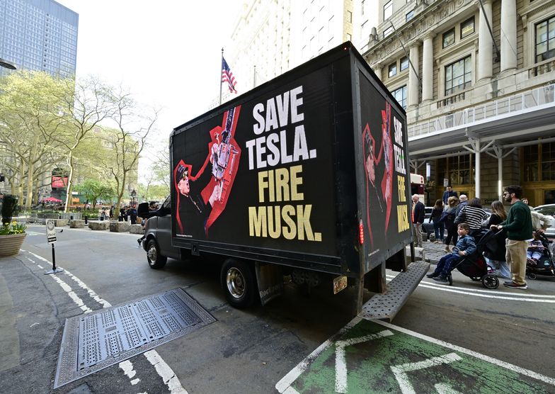 NEW YORK, NEW YORK - APRIL 22: A truck with signage reading "Save Tesla. Fire Musk" drives around Manhattan on April 22, 2025 in New York City. (Photo by Eugene Gologursky/Getty Images for Save Telsa Fire Musk Campaign)