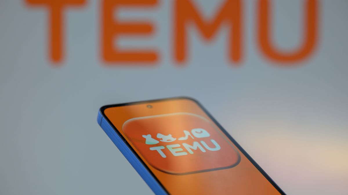 The Temu app icon is displayed on a mobile phone with Temu in the background in this photo illustration in Brussels, Belgium, on July 30, 2025. (Photo by Jonathan Raa/NurPhoto via Getty Images)