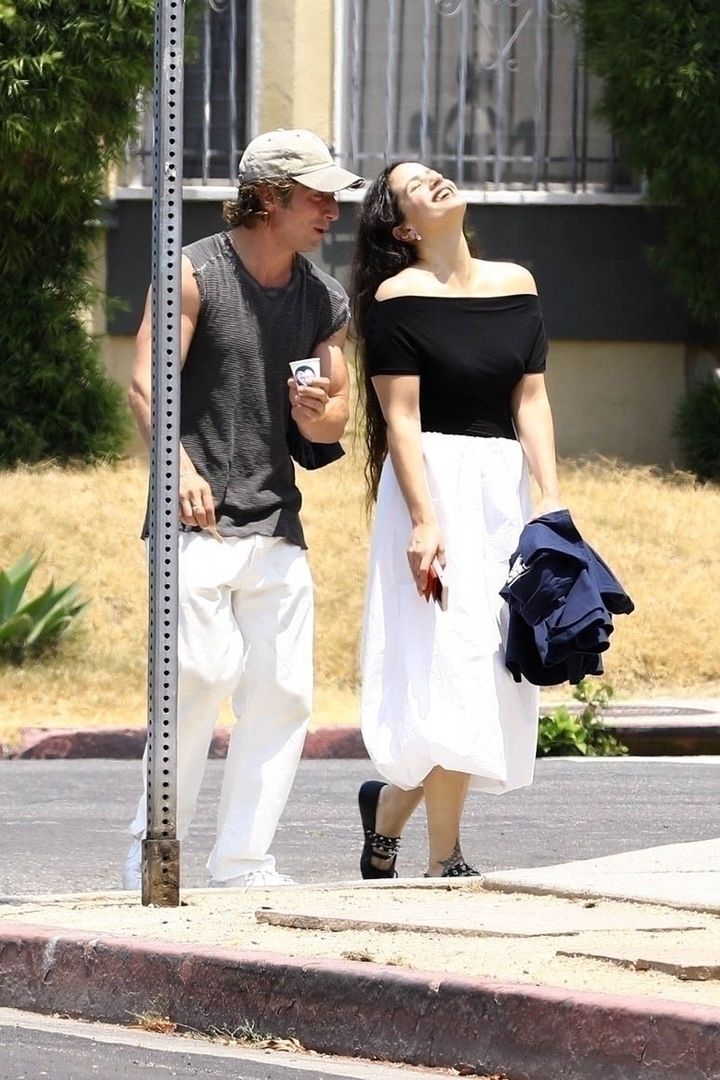 *PREMIUM-EXCLUSIVE* Happy and in love! Jeremy Allen White and Rosalia are all smiles amid split rumors while stepping out together in WeHo! **WEB EMBARGO UNTIL July 14, 2024 @ 7:50pm ET**BACKGRID / Backgrid USA / ForumJeremy Allen White, Rosalie, Sleeveless T-Shirt, Baseball Cap, White Pants, White Skirt, Black T-Shirt, Couple, Happy, In Love, Fashion, Style, Singer, Actor