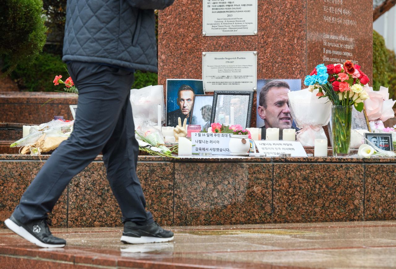 SEOUL, SOUTH KOREA - 2024/02/21: A man walks past the memorial site for the late Russian opposition leader Alexei Navalny in Pushkin Plaza in Seoul. Alexei Navalny (4 June 1976  16 February 2024) was a Russian opposition leader, lawyer, anti-corruption activist, and political prisoner. He organized anti-government protests and run for public office to oppose corruption in Russia and advocate for reforms against President Vladimir Putin and his government. (Photo by Kim Jae-Hwan/SOPA Images/LightRocket via Getty Images)