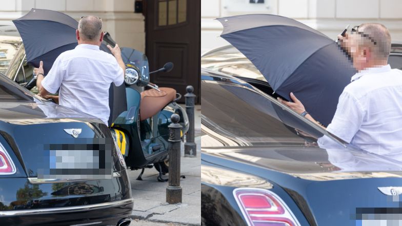 Izabela Janachowska zasłania się parasolem w drodze do samochodu