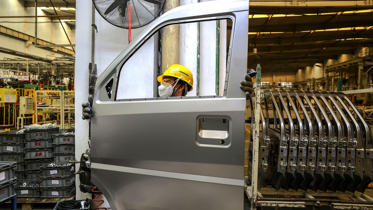 QINGDAO, CHINA - JANUARY 2, 2025 - Employees assemble car door parts at a production workshop of an automobile manufacturer in Qingdao, East China's Shandong province, Jan 2, 2025. (Photo credit should read CFOTO/Future Publishing via Getty Images)