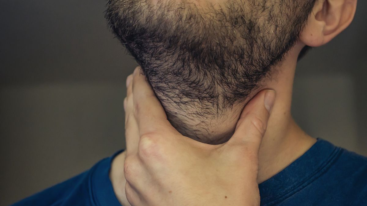 A young man with a sore throat.
A young man with a sore throat. With his hand on the neck, sharp pain in the throat. Close up.
Anastasiia Gorshkova
healthcare