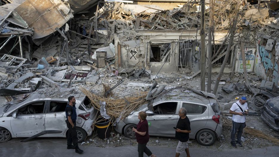 Temporary
Israelis inspect the rubble of a building a day after it was hit by a rocket fired from the Gaza Strip, in Tel Aviv, Israel, Sunday, Oct. 8, 2023. The militant Hamas rulers of the Gaza Strip carried out an unprecedented, multi-front attack on Israel at daybreak Saturday, firing thousands of rockets as dozens of Hamas fighters infiltrated the heavily fortified border in several locations by air, land, and sea, killing hundreds and taking captives. Palestinian health officials reported scores of deaths from Israeli airstrikes in Gaza. (AP Photo/Oded Balilty)
Oded Balilty