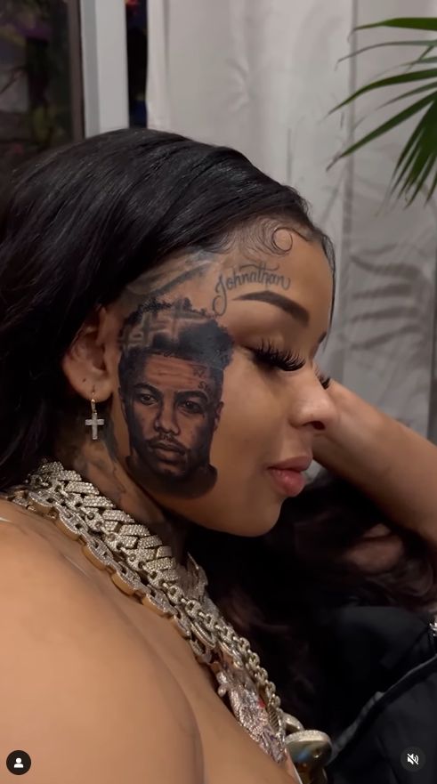 She tattooed her partner's face on her cheek.