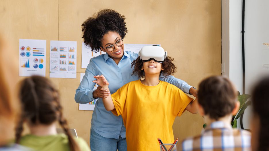 Innovation in education. Student schoolgirl in virtual reality glasses together with teacher during lesson in classroom at school
Innovation in education. Student schoolgirl  in virtual reality glasses together with teacher during lesson in bright classroom at school
education, classroom, school, technology, vr, class, innovation, virtual, reality, children, 3d, glasses, boy, lesson, digital, student, headset, entertainment, young, learning, science, girl, device, goggles, futuristic, knowledge, simulation, studying, teacher, happy, gesture, child, childhood, tech, female, experience, pupil, kid, computer, college, augmented, teacher, modern, learn, study, multinational, elementary, vision, teenager, playing, education, classroom, school, technology, vr, class, innovation, virtual, reality, children, 3d, glasses, boy, lesson, digital, student, headset, entertainment, young, learning, science, girl, device, goggles, futuristic, knowledge, simulation, studying, teacher, happy, gesture, child, childhood, tech, female, experience, pupil, kid, computer, college, augmented, modern, learn, study, multinational, elementary, vision, teenager