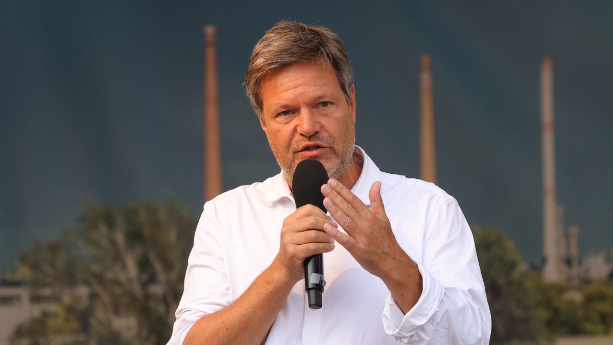 SCHWEDT, GERMANY - JUNE 29: Federal Minister for Economic Affairs and Climate Action Robert Habeck delivers a speech as people, including workers from the nearby PCK oil refinery, gather to demand an end to the current, planned German embargo against the import of Russian oil on June 29, 2022 in Schwedt, Germany. Schwedt relies heavily on the jobs at the PCK refinery, and many worry for their economic future since the refinery receives its crude oil exclusively from Russia via the "Friendship" ("Druzhba") pipeline. Germany plans to end its imports of Russian oil within the near future due to Russia's ongoing war in Ukraine and is also seeking to possibly nationalize the refinery, which is currently majority-owned by Russian energy company Rosneft. (Photo by Omer Messinger/Getty Images)