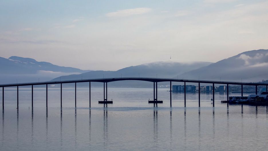 Design Pics 09/2021
Silhouette of the Tromso Bridge crossing the Tromsoysundet Strait between Tromsdalen on the mainland and the Island of Tromsoya in the port town of Tromso north of the Arctic Circle on the west coast of Norway; Tromso, Troms og Finnmark, Norway
Chris Caldicott