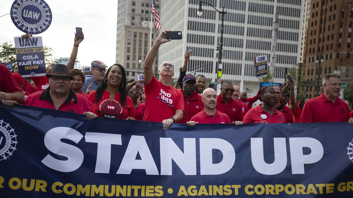 DETROIT, MICHIGAN - SEPTEMBER 15: UAW President Shawn Fain marches with UAW members through downtown Detroit  after a rally in support of United Auto Workers members as they strike the Big Three auto makers on September 15, 2023 in Detroit, Michigan. This is the first time in history that the UAW is striking all three of the Big Three auto makers, Ford, General Motors, and Stellantis, at the same time. (Photo by Bill Pugliano/Getty Images)