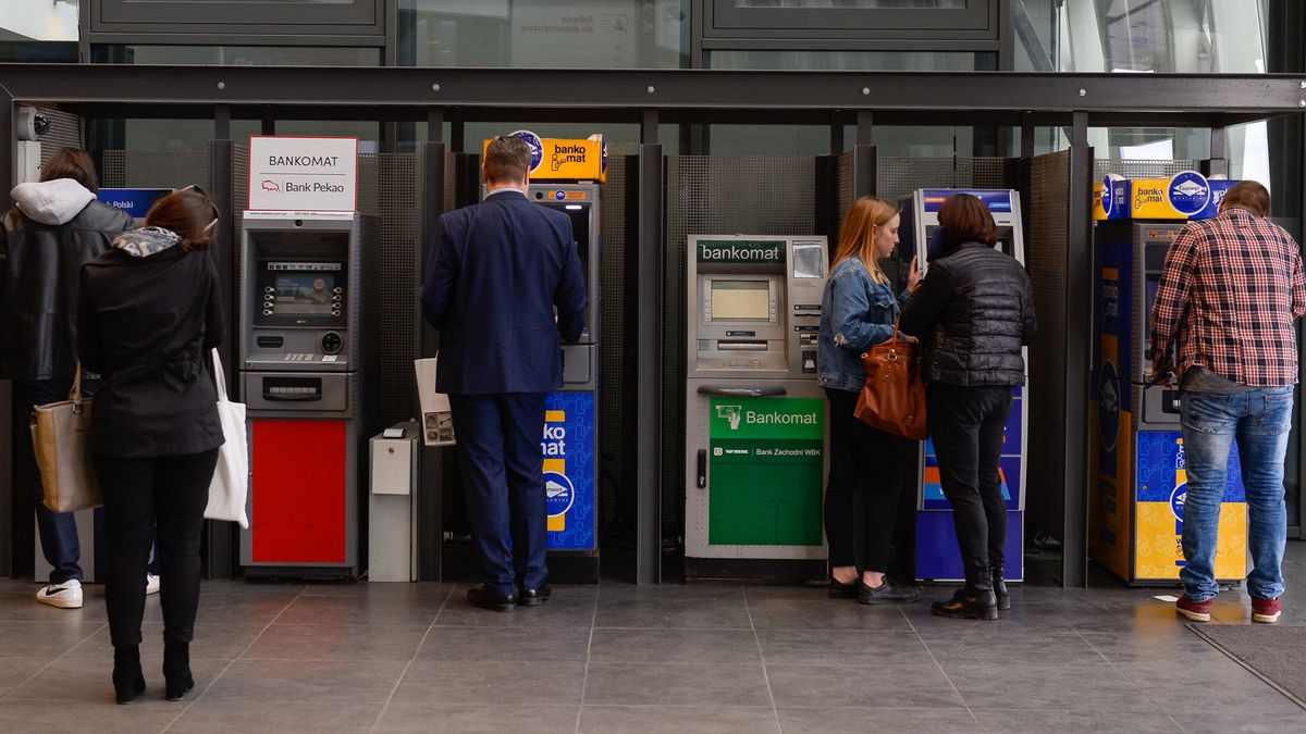 People take money out of ATM's at the main train station inPOZNAN, POLAND - 2018/04/05: People take money out of ATM's at the main train station in Poznan.Poland is a country located in central eastern europe neighbouring Germany to the west and Ukraine to the east. (Photo by Omar Marques/SOPA Images/LightRocket via Getty Images)SOPA ImagesPoznan, Poland, 2018, April, Spring, Poznan train station, poznan main station, trains, platforms, public transport, international connections, national connections, wagons, Poznan Glowny, Eu funds, European Union, ATM, money, transfers, currencies, ATM at train station
