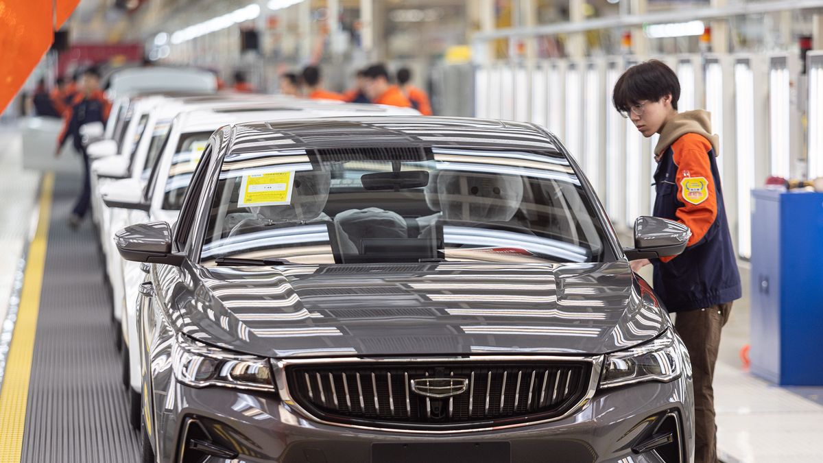 CHANGXING, CHINA - APRIL 06: Employees work on the assembly line of Emgrand sedan at Geely Auto's Changxing Plant on April 6, 2022 in Changxing County, Huzhou City, Zhejiang Province of China. (Photo by Yi Fan/VCG via Getty Images)