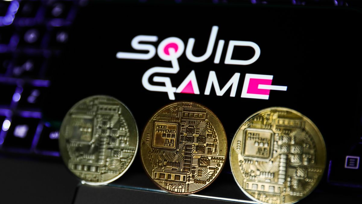 Representation of cryptocurrency and Squid Game logo displayed on a phone screen are seen in this illustration photo taken in Krakow, Poland on October 30, 2021. (Photo by Jakub Porzycki/NurPhoto via Getty Images)