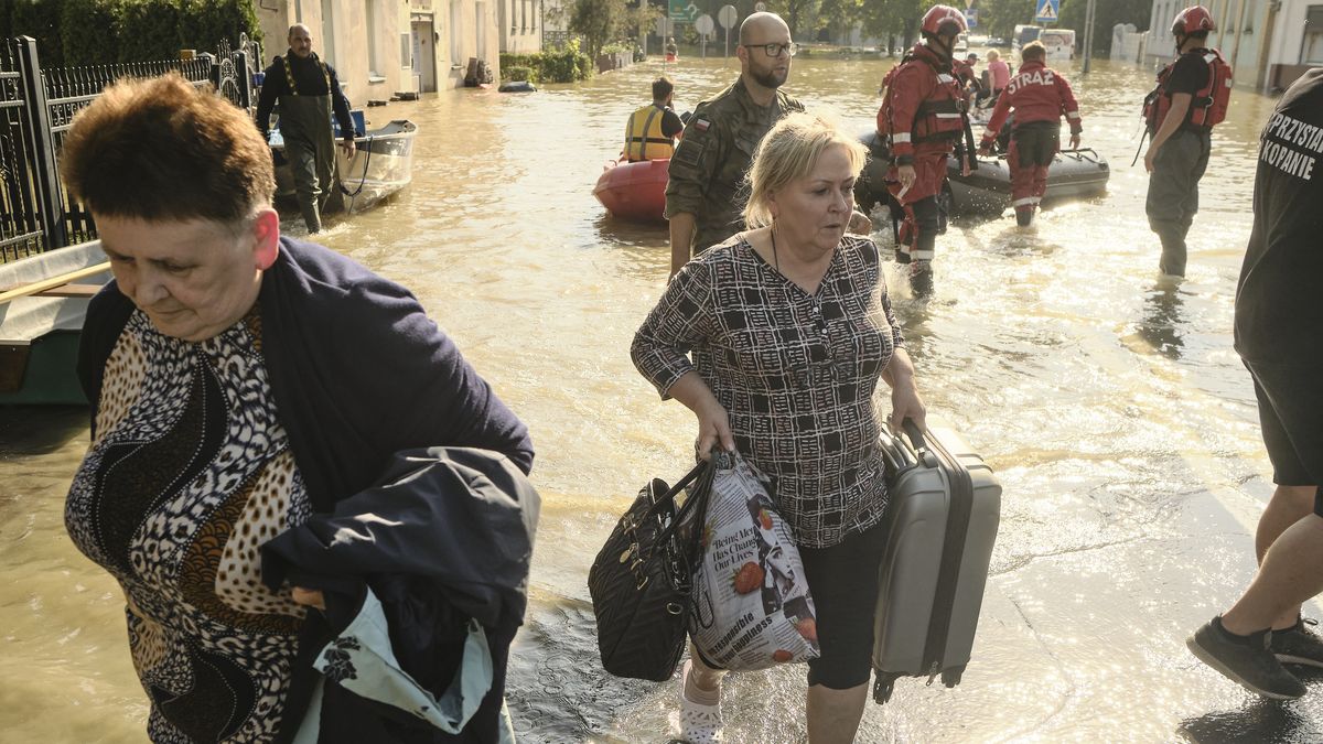 Emergency service personnel help evacuate residents from the flooded town of Lewin Brzeski, southwestern Poland, on Tuesday, Sept. 17, 2024. The government will outline a reconstruction plan once the floodwaters subside, using both state funds and some of the 1.5 billion ($1.7 billion) made available by the European Union for impacted countries, Polish Prime Minister Donald Tusk said. Photographer: Bartek Sadowski/Bloomberg via Getty Images