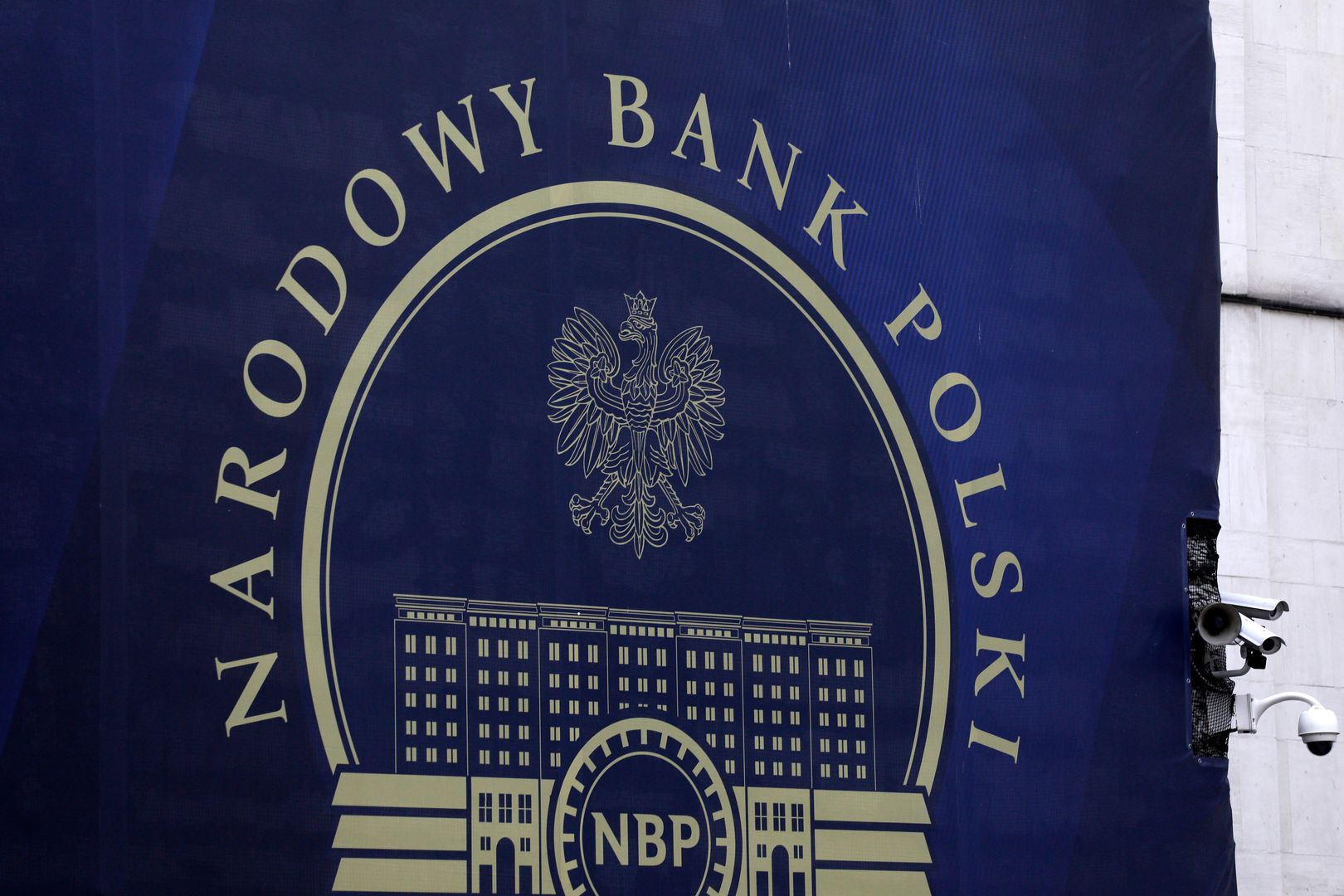 Signage for Poland's central bank, also known as Narodowy Bank Polski (NBP), at an entrance to the bank's headquarters in Warsaw, Poland, on Wednesday, Feb. 9, 2022. Poland increased borrowing costs for a fifth consecutive month to an almost nine-year high as pressure grows on the central bank to tame record inflation in eastern Europe's largest economy Photographer: Piotr Malecki/Bloomberg via Getty Images