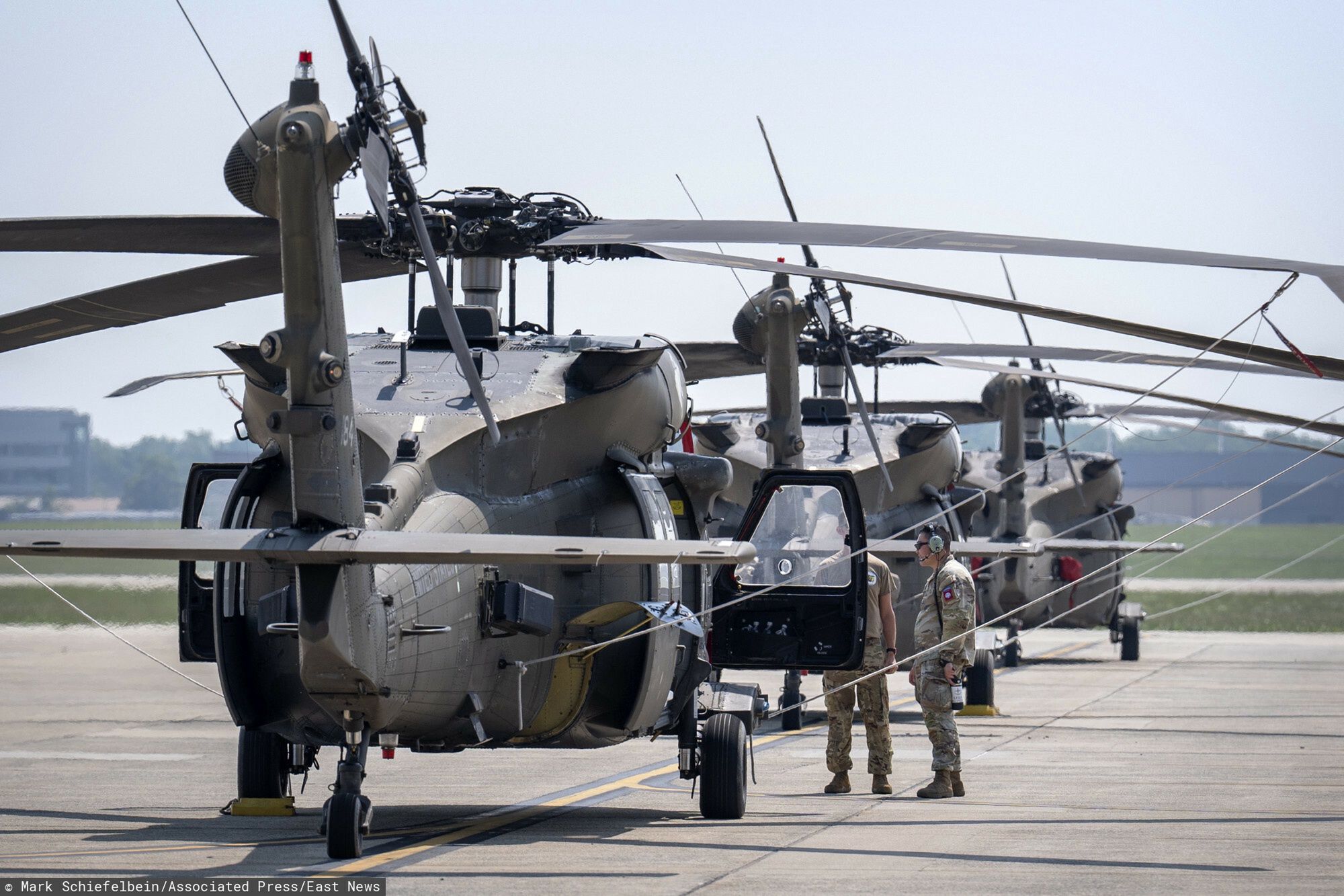 Temporary
Crew members stand near U.S. Army UH-60M Black Hawk helicopters that will participate in an upcoming military parade commemorating the Army's 250th anniversary and coinciding with President Donald Trump's 79th birthday, at Joint Base Andrews, Md., Thursday, June 12, 2025. (AP Photo/Mark Schiefelbein)
Mark Schiefelbein