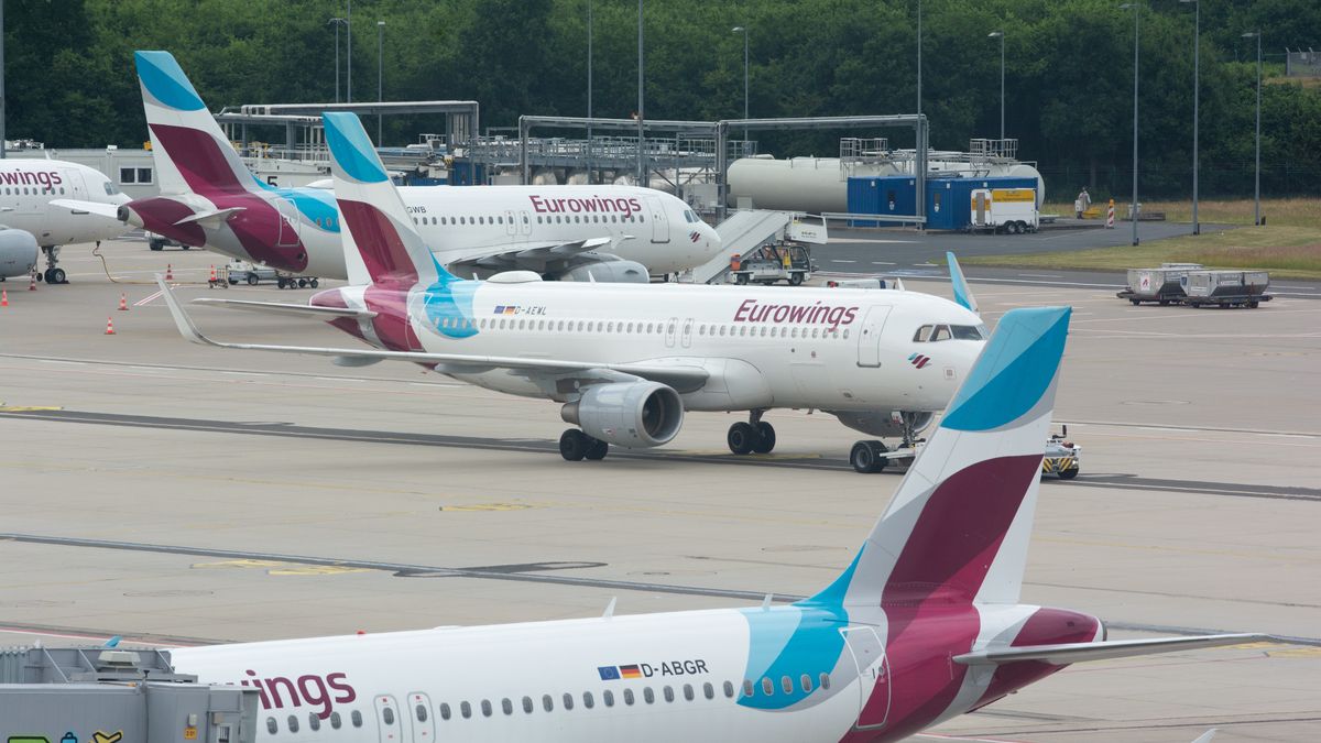 several Eurowings airplanes are seen parked  at Cologne &amp; Bonn airport in Cologne, Germany on June 21, 2022 as airline is dealing with staff shortages during the holiday season (Photo by Ying Tang/NurPhoto via Getty Images)