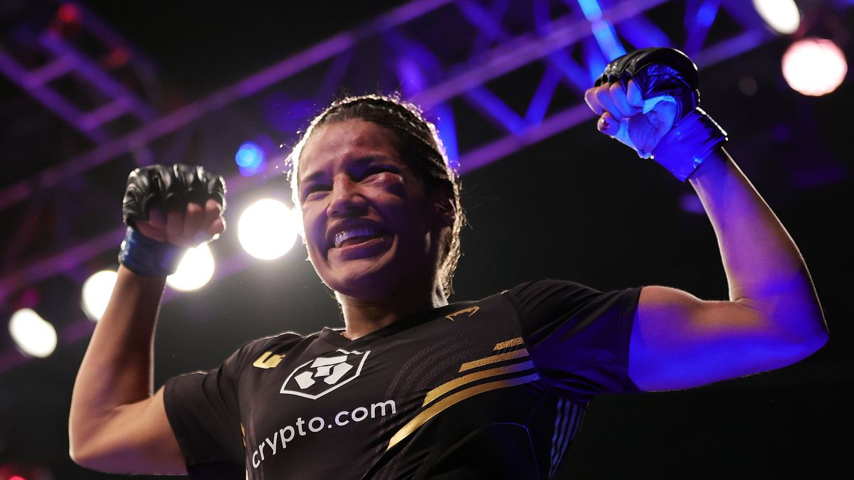 LAS VEGAS, NEVADA - DECEMBER 11: Julianna Pena celebrates after defeating Amanda Nunes of Brazil to win the women's bantamweight title fight during the UFC 269 event at T-Mobile Arena on December 11, 2021 in Las Vegas, Nevada. (Photo by Carmen Mandato/Getty Images)