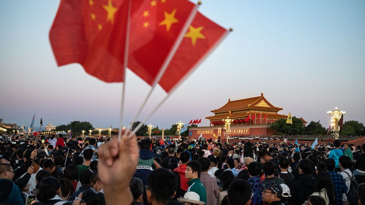 Visitors gather for the flag raising ceremony at Tiananmen Square to mark National Day in Beijing, China on Sunday, Oct. 1, 2023. President Xi Jinping on Thursday vowed to step up efforts to meet the country's economic targets at a speech marking the 74th anniversary of the founding of the People's Republic of China. Photographer: Andrea Verdelli/ Bloomberg