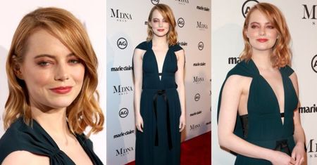 Skromna Emma Stone uśmiecha się na ściance