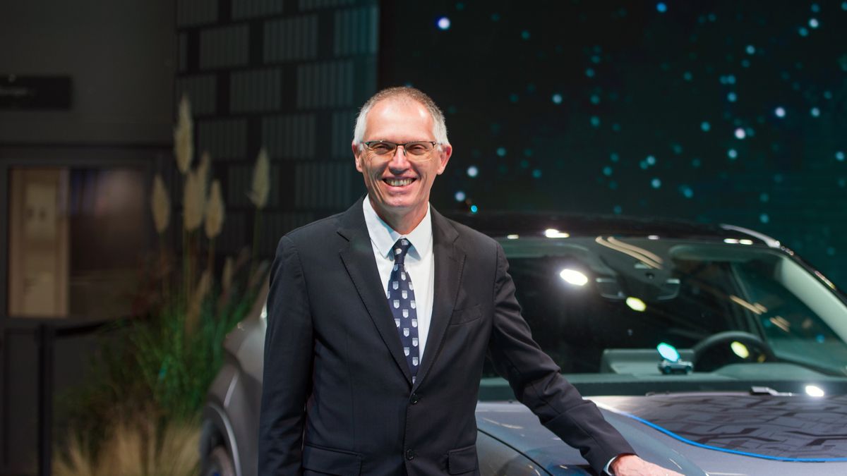 Carlos Tavares, chief executive officer of Stellantis NV, next to the all-electric Jeep Avenger SUV following a Bloomberg Television Interview during the opening day of the Paris Motor Show in Paris, France, on Monday, Oct. 17, 2022. The risk of Chinese manufacturers grabbing market share in Europe "is there," but it's "marginal" compared to what the European Union offered to the Chinese competition in terms of opening up the region's auto market, said Taveres. Photographer: Nathan Laine/Bloomberg via Getty Images