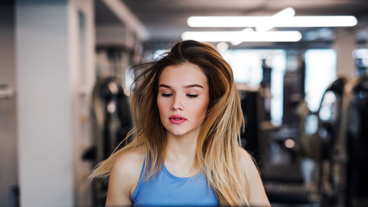 A portrait of young girl or woman doing cardio workout in a gym.
A portrait of a beautiful young girl or woman doing cardio workout in a gym.
Halfpoint