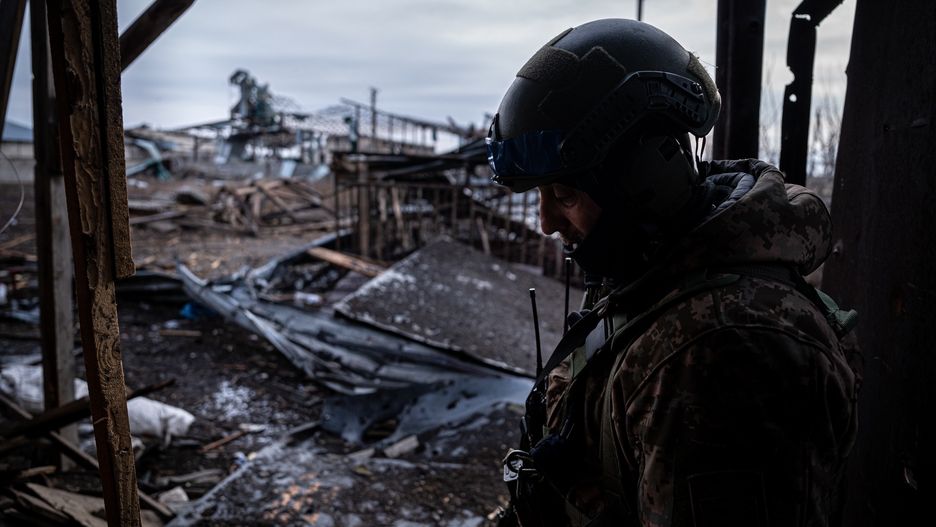 VELYKA NOVOSILKA, DONBAS, UKRAINE - MARCH 7: Ukrainian servicemen of the Ukrainian Volunteer Army patrols stands at his positions at the frontline, at an undisclosed location next to the Vuhledar frontline, Ukraine March 7, 2023. The frontline around the city of Vuhledar, a strategic rail and road hub south of Bakhmut, resembles an apocalyptic scenario. Destroyed buildings and burned cars are scattered at both sides of the road. There, hidden on basements of abandoned houses, the Ukrainian Volunteer Army hold their positions against relentless attacks by Russian forces. Under the threat of the enemyâs artillery, that echoes through the village, soldiers hold their fortified positions in shifts of 12h. In recent days, they said, they have been able to repel several Russian offensives. (Photo by Ignacio Marin Fernandez/Anadolu Agency via Getty Images)