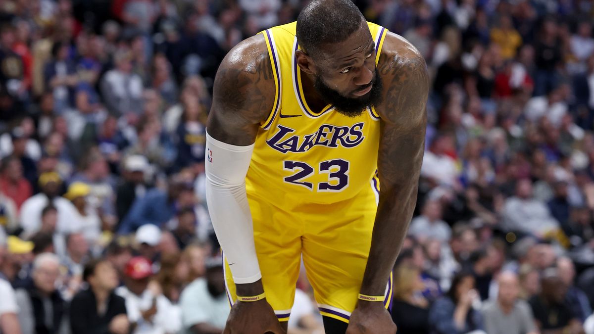 DENVER, COLORADO - APRIL 29: LeBron James #23 of the Los Angeles Lakers gathers himself after taking a hard hit while playing the Denver Nuggets in the third quarter during game five of the Western Conference First Round Playoffs at Ball Arena on April 29, 2024 in Denver, Colorado. NOTE TO USER: User expressly acknowledges and agrees that, by downloading and or using this photograph, User is consenting to the terms and conditions of the Getty Images License Agreement.  (Photo by Matthew Stockman/Getty Images)