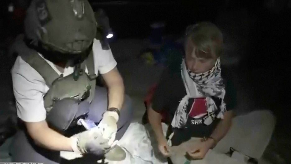 Temporary
This image taken from video released by the Israeli Foreign Ministry claims to show activist Greta Thunberg, right, as she is removed after the Israeli navy intercepted the Global Sumud Flotilla carrying humanitarian aid towards Gaza on Wednesday, Oct. 1, 2025. (Israeli Foreign Ministry via AP)
