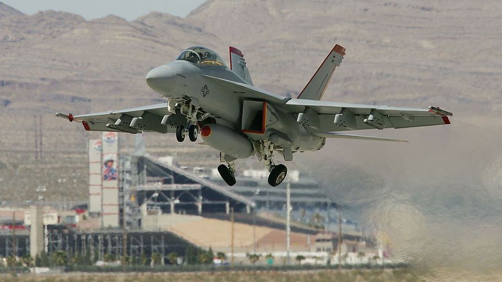 Air Force Holds Joint Expeditionary Force Experiment 2006
NELLIS AFB, NV - APRIL 25:  A United States Navy F/A-18F Super Hornet, the first one ever produced by Boeing Co., takes off from Nellis Air Force Base while participating in the Joint Expeditionary Force Experiment 2006 (JEFX 06) April 25, 2006 in Las Vegas, Nevada. JEFX is a biannual test of new systems and technologies by every branch of the military in an attempt to speed their introduction into the modern battlefield. This year's tests involve about 1,400 personnel from the United States, Great Britain, Canada and Australia studying new technologies during mock combat over the Nevada desert and center on finding better ways to communicate critical information between armed forces.  (Photo by Ethan Miller/Getty Images)
Ethan Miller
57381706, EOS1DMkII-253015