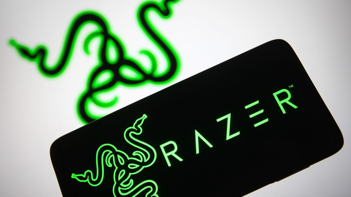 UKRAINE - 2021/11/16: In this photo illustration, a Razer Inc. logo is seen on a smartphone screen and in the background. (Photo Illustration by Pavlo Gonchar/SOPA Images/LightRocket via Getty Images)