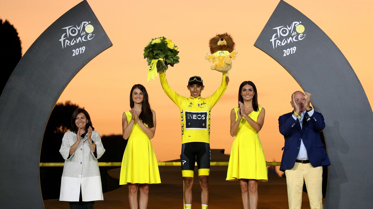 PARIS, FRANCE - JULY 28: Podium / Egan Bernal of Colombia and Team INEOS Yellow Leader Jersey / Celebration / Anne Hidalgo Paris Mayor / Miss / Hostess / during the 106th Tour de France 2019, Stage 21 a 128km stage from Rambouillet to Paris Champs-Élysées / TDF / #TDF2019 / @LeTour / on July 28, 2019 in Paris, France. (Photo by Chris Graythen/Getty Images)