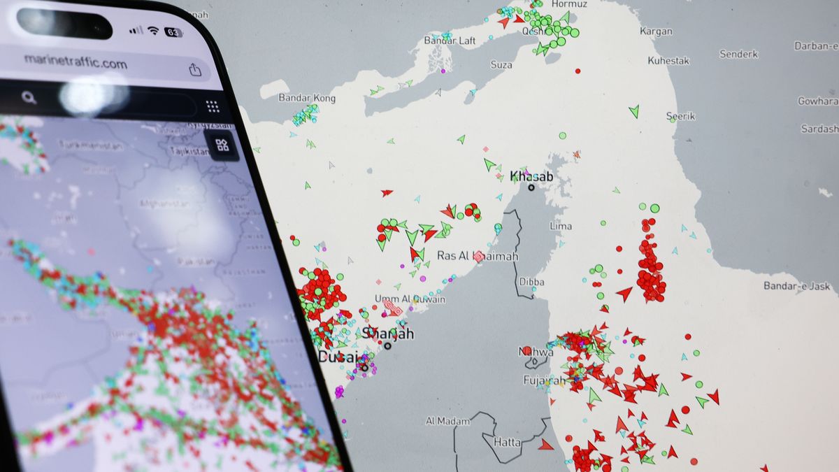 MarineTraffic map showing current ships traffic on Strait of Hormuz dislplayed on a laptop and a phone screens are seen in this illustration photo taken in Krakow, Poland on March 5, 2026. (Photo by Jakub Porzycki/NurPhoto via Getty Images)