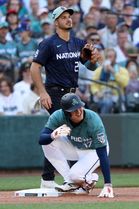 Shohei Ohtani of Japan (Down), American League player for the Los Angeles Angels slides safely into third base after advancing on a American League Bo Bichette of the Toronto Blue Jays fly out to right field as National League third baseman Noland Arenado (L) looks on during the the fourth inning of the 93rd MLB All-Star Game between the American League and the National League at T-Mobile Park in Seattle, Washington, USA, 11 July 2023. EPA/ANTHONY BOLANTE Dostawca: PAP/EPA.