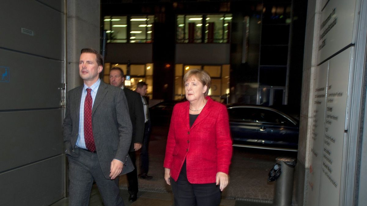 Steffen Seibert i Angela Merkel