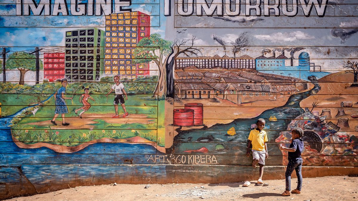 NAIROBI, KENYA - 2023/02/03: Children stand in front of a mural in Kibera slum, Nairobi, Kenya. Kibera is the biggest slum in Africa and one of the biggest in the world. It houses an estimated population of 1 million people living in a situation of extreme poverty. A vast majority of the people lack access to basic services and medical care: only about 20% of Kibera has electricity, and the water that reaches its shacks is not clean and causes typhoid and cholera. In most of Kibera there are no toilet facilities. Unemployment rates are high and most people cannot afford education for their children. (Photo by Simone Boccaccio/SOPA Images/LightRocket via Getty Images)