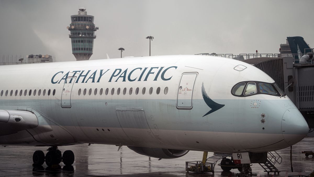 A Cathay Pacific Airways Ltd. aircraft on the tarmac at Hong Kong International Airport in Hong Kong, China, on Wednesday, May 7, 2025. Cathay's full-year profit inched higher, defying expectations for a drop, as the carrier benefited from continued strong demand for air travel and robust cargo volumes. Photographer: Lam Yik/Bloomberg via Getty Images