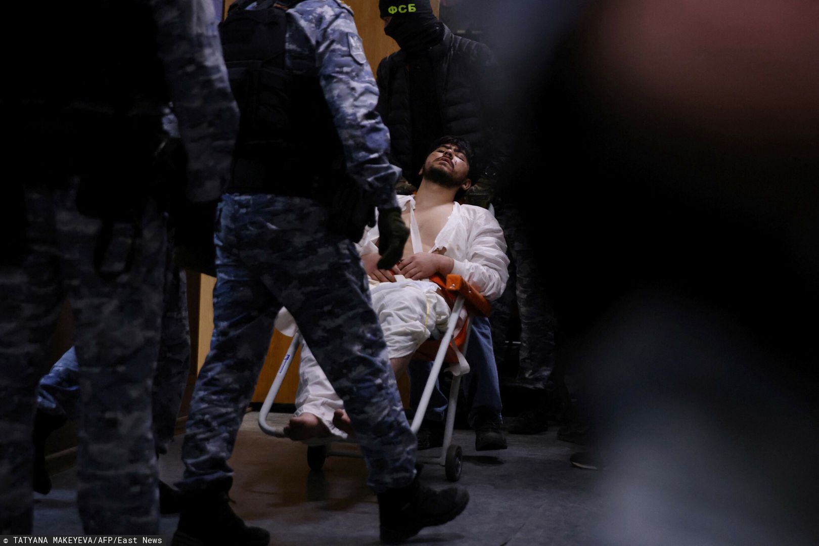 TemporaryA man suspected of taking part in the attack of a concert hall that killed 137 people, the deadliest attack in Europe to have been claimed by the Islamic State jihadist group, is escorted by Russian law enforcement officers prior to his pre-trial detention hearing at the Basmanny District Court in Moscow on March 25, 2024. At least 137 people, including three children, were killed when camouflaged gunmen stormed the Crocus City Hall, in Moscow's northern suburb of Krasnogorsk, and then set fire to the building on March 22 evening. (Photo by TATYANA MAKEYEVA / AFP)TATYANA MAKEYEVA