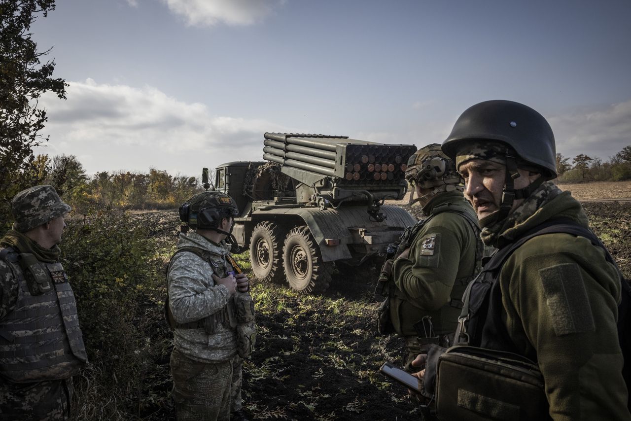 AVDIIVKA, UKRAINE - OCTOBER 23. Soldiers from Ukraine's 59th Brigade wait to fire a Grad Multiple Launch Missile System at a firing position around 8km the Avdiivka front line on 23rd October 2023, in Donetsk Region, Ukraine. Ukrainian defences are coming under increased pressure as Russia's military drives to capture the destroyed city of Avdiivka. (Photos by Ed Ram/For The Washington Post via Getty Images)