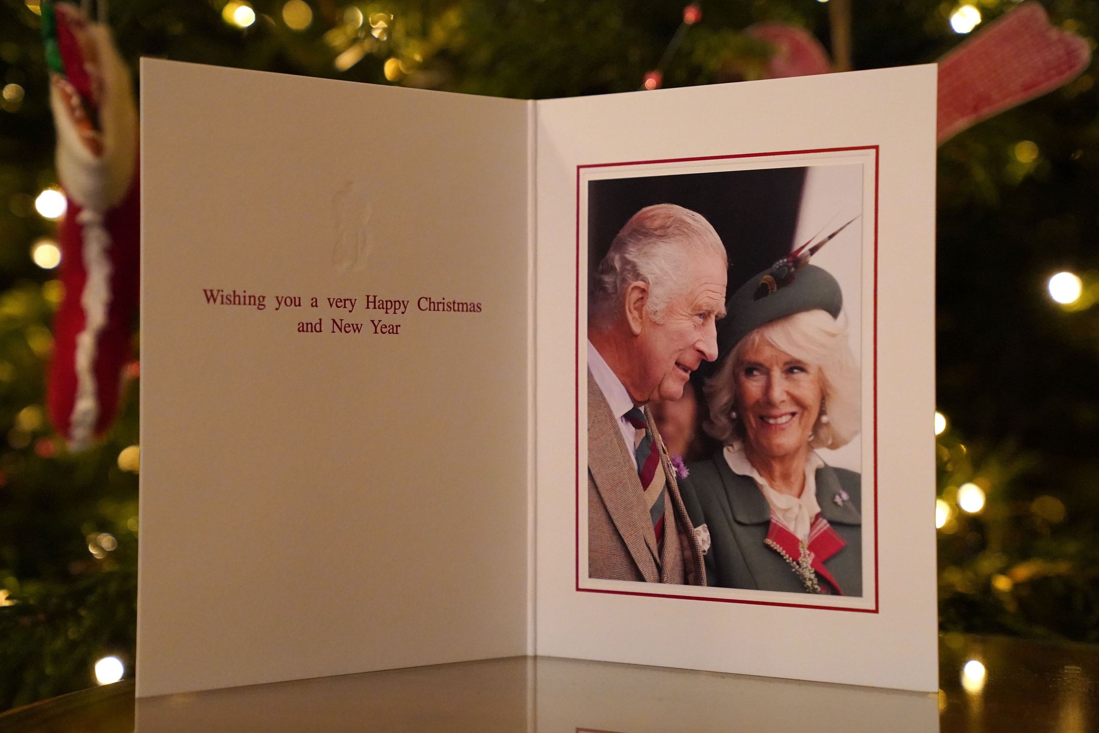 King Charles III And Queen Consort Release Their Christmas CardsLONDON, ENGLAND - DECEMBER 11:  The 2022 Christmas card of King Charles III and the Queen Consort in front of a Christmas tree in Clarence House, London, on December 11, 2022 in London, England. The photograph was taken at the Braemar Games on the 3rd September 2022 by Samir Hussein. (Photo Jonathan Brady - WPA Pool/Getty Images)WPA Poolbestof, topix
