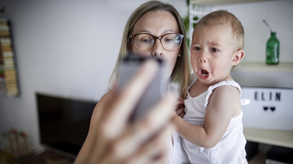 Mother taking a selfie with baby daughterOliver Rossi