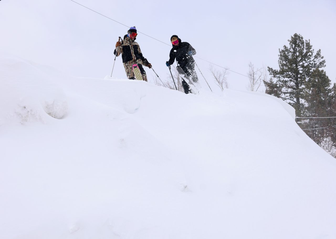 TRUCKEE, CALIFORNIA - MARCH 03: Graham Adeson and Brody Kellish, of Truckee, from left, ski down a plowed mound of snow in downtown Truckee, Calif., on Sunday, March 3, 2024. (Jane Tyska/Digital First Media/East Bay Times via Getty Images)