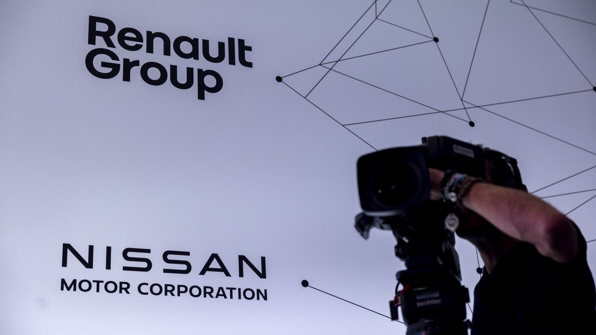 The logos of Renault SA and Nissan Motor Co. during a news conference in London, UK, on Monday, Feb. 6, 2023. Renault SA and Nissan Motor Co. signed a deal aimed at easing longstanding tensions between the two companies, allowing them to move forward at a time of unparalleled challenges for the automotive industry. Photographer: Jason Alden/Bloomberg via Getty Images