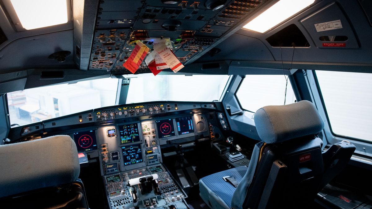 The cockpit of an Airbus SE A330 airplane during a tour of a new maintenance hangar and control tower, at Chateauroux-Centre "Marcel Dassault" Airport in Chateauroux, France, on Friday, July 1, 2022. Many airlines struggled to see a future for their enormous Airbus SE A380s when the pandemic grounded fleets in early 2020 but Frances Chateauroux airport, about 250 kilometers south of Paris, is opening their giant hanger equipped to handle the double-deckers and up to five or six narrow bodies. Photographer: Benjamin Girette/Bloomberg via Getty Images