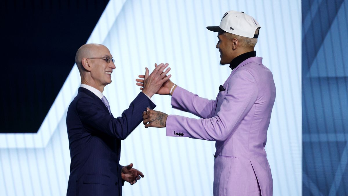 NEW YORK, NEW YORK - JUNE 23: NBA commissioner Adam Silver (L) and Jeremy Sochan react after Sochan was drafted with the 9th overall pick by the the San Antonio Spurs during the 2022 NBA Draft at Barclays Center on June 23, 2022 in New York City. NOTE TO USER: User expressly acknowledges and agrees that, by downloading and or using this photograph, User is consenting to the terms and conditions of the Getty Images License Agreement. (Photo by Sarah Stier/Getty Images)