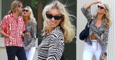 Przypalona słońcem Elsa Hosk wygina się przy ścianie w spontanicznej sesji zdjęciowej
